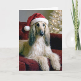 Tarjeta Navidades aferran a un sofá de terciopelo