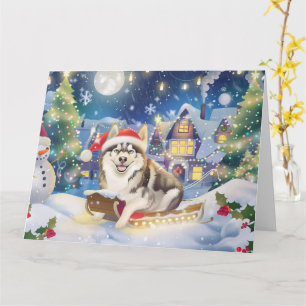 Tarjeta Navidades de Alaska Malamute en Nieve en Sleigh