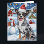 Tarjeta Navidades de Blue Heeler Dog Winter Wonderland Ale<br><div class="desc">Este diseño festivo capta el alegre espíritu de la temporada navideña, con un adorable cachorro vestido con un sombrero de Santa. El perro está enclavado en un maravilloso país invernal, con un muñeco de nieve, un árbol de Navidad decorado y regalos hermosamente envueltos. Los copos de nieve caen suavemente, añadiendo...</div>
