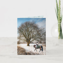 Tarjeta Navidades de equitación en el paisaje invernal