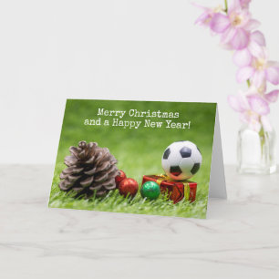 Tarjeta Navidades de fútbol vacaciones con cono de pino y 