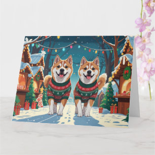 Tarjeta Navidades de perros Akita en vacaciones de nieve