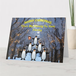 Tarjeta Navidades Familia de Pingüinos divirtiéndose