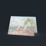 Tarjeta Navidades únicos de Beach Flamingo Wreath<br><div class="desc">Feliz Navidad en esta preciosa playa de Watercolor - escena tranquila y suave con dos tumbonas - flamencos amistosos con una hermosa corona - Palmera con algunos adornos. También disponible en diferentes pesos de papel: su selección. Cualquier pregunta de diseño, sólo envíe un correo electrónico a charmdesignstudio@rcn.com y estaremos encantados...</div>