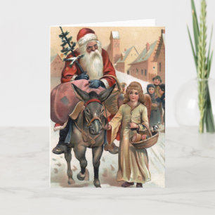 Tarjeta navideña Santa sobre el burro
