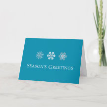Tarjeta navideña simple con copos de nieve azul