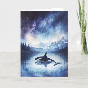 Tarjeta Orca en medio de las estrellas y montañas