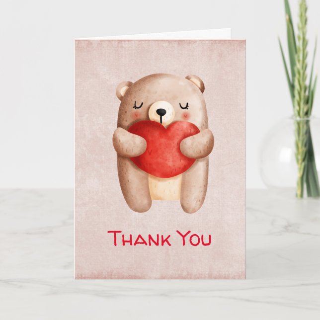Tarjeta Oso de peluche llevando un corazón rojo gracias (Anverso)
