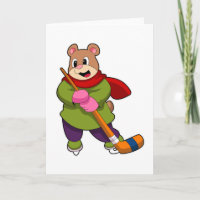 Oso en hockey sobre hielo con palo de hockey sobre