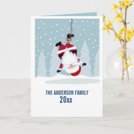 Tarjeta Papá Noel divertido colgado boca abajo