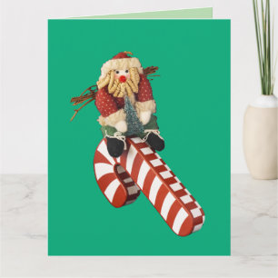 Tarjeta Papá Noel juega en un tobogán de bastón de caramel