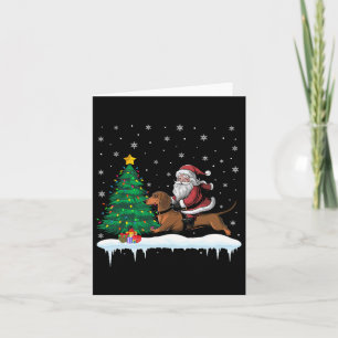 Tarjeta Papá Noel montado en perro dachshund niños niñas