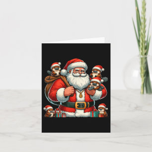 Tarjeta Papá Noel norteamericano sostiene Navidad Presente