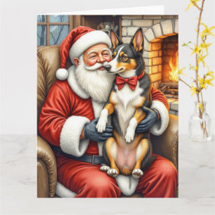 Tarjeta Papá Noel sosteniendo una Navidad de Kelpie austra