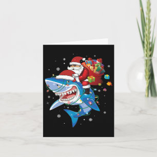 Tarjeta Papá Noel viajando en el tiburón por su amor navid
