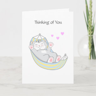 Tarjeta Pensando en ti gatito con corazón en hamaca