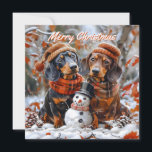 Tarjeta Pequeña Dachshunds con Navidad de Muñeco de Nieve<br><div class="desc">Celebra la temporada festiva con esta emotiva tarjeta de Navidad de Dachshund con dos encantadores Dachshunds vestidos con sombreros y bufandas acogedoras. Ambientada en una pintoresca escena invernal, los Dachshunds se sientan junto a un alegre muñeco de nieve que lleva un sombrero de copa y una bufanda. Rodeada de piñas...</div>
