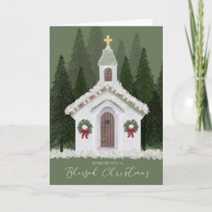 Tarjeta Pequeña iglesia blanca navidad en bosque de nieve