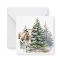 Marrón y ternera blanca frente a un pino