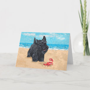 Tarjeta Pequeño Scottie encuentra un cangrejo en la playa