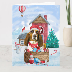 Tarjeta Perro Basset Hound en la casa de perro de Navidad