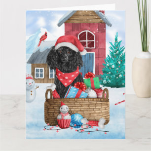 Tarjeta Perro de raza Caniche en casa de Navidad con nieve
