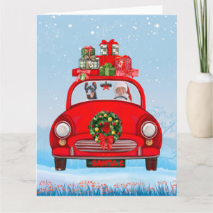 Tarjeta Perro Doberman en auto con Santa Claus