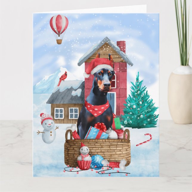 Tarjeta Perro Doberman en casa de Navidad con nieve (Anverso)