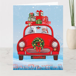 Tarjeta Perro esquimal americano en auto con Santa Clause