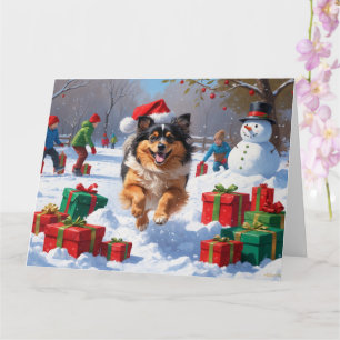Tarjeta Perro Keeshond corriendo en la nieve con sombrero