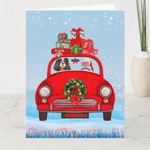 Tarjeta Perro King Cavalier en coche con Papá Noel 