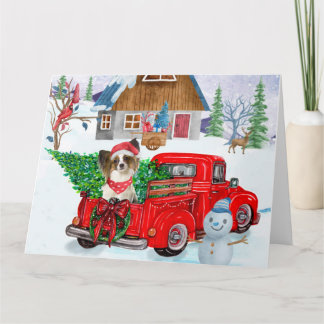 Tarjeta Perro Papillon en camión de entrega de Navidad nie