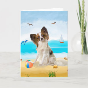 Tarjeta Perro Papillon en la playa