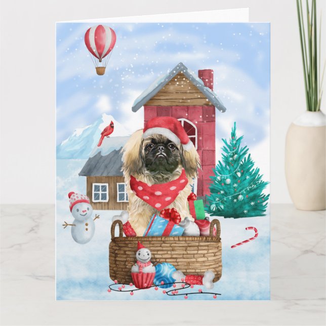 Tarjeta Perro pequinés en casa de Navidad con nieve (Anverso)