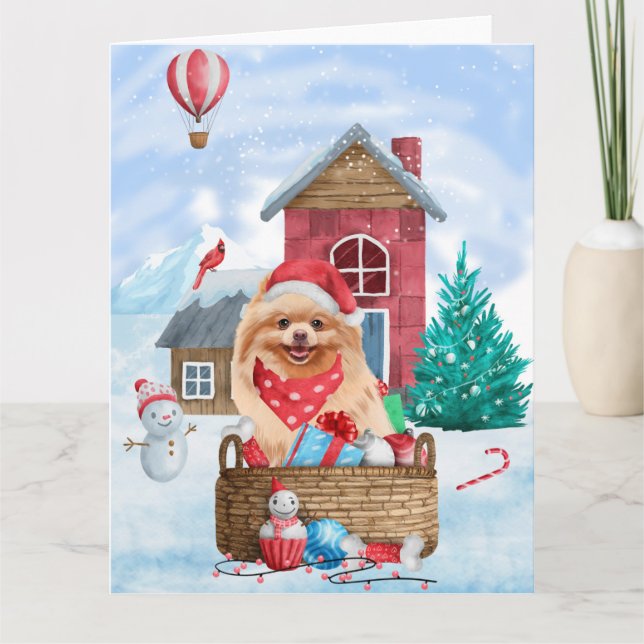 Tarjeta Perro Pomerania en casa de perro de Navidad con ni (Anverso)