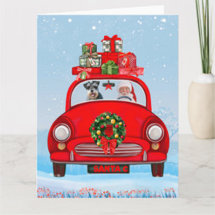 Tarjeta perro schnauzer en auto con Santa Claus