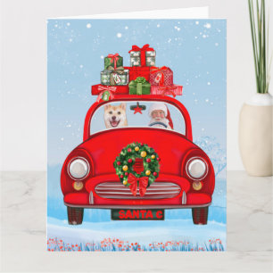 Tarjeta Perro Shiba Inu en coche con Papá Noel