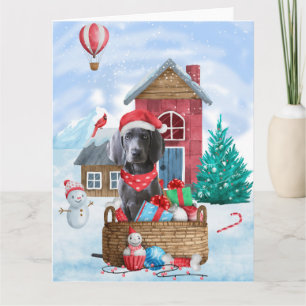 Tarjeta Perro Weimaraner en la casa de Navidad con nieve