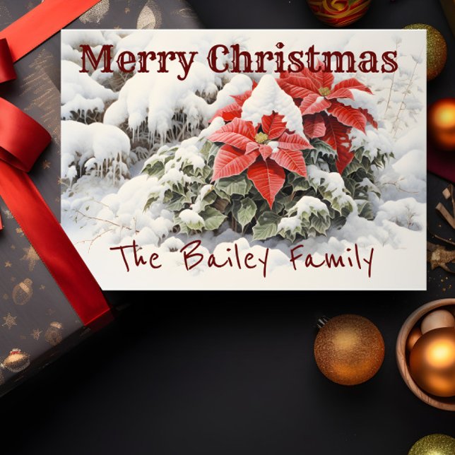 Tarjeta Poinsettia Merry Christmas (A Christmas card depicting red poinsettias in the snow is shown with a present and decorations.)