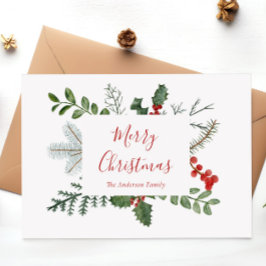 Tarjeta postal de Navidad con vegetación y bayas d
