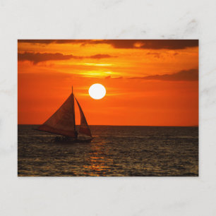 Tarjeta postal de puesta de sol en la playa de una
