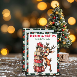 Tarjeta postal retro roja de Navidad con reno ador
