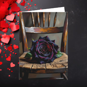 Tarjeta Preciosa rosa negra en silla rústica día de San Va