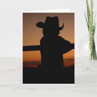 Tarjeta Puesta del sol de la silueta del vaquero de