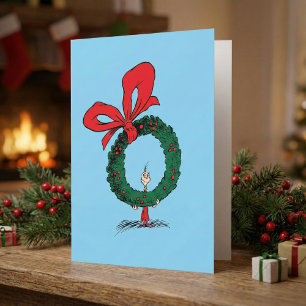 Tarjeta Quién se asoma a través de la corona de Navidad