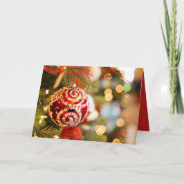 Tarjeta roja del día de fiesta del ornamento del