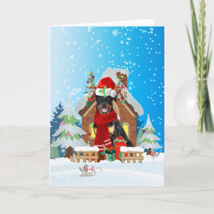 Tarjeta Rottweiler nevado con regalos de Navidades