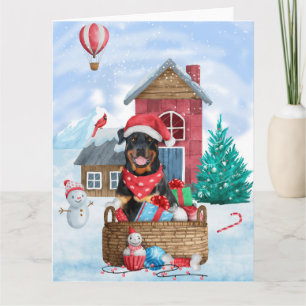 Tarjeta Rottweiler perro en casa de perro de Navidad en la