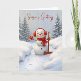 Tarjeta Saludos de temporada Muñeco de nieve con una pala