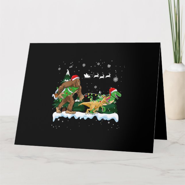 Tarjeta Santa Bigfoot Llevando Dinosaur Merry Christmas fo (Anverso)